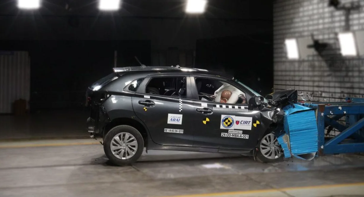 Passenger car undergoing crash safety testing at an automotive test facility